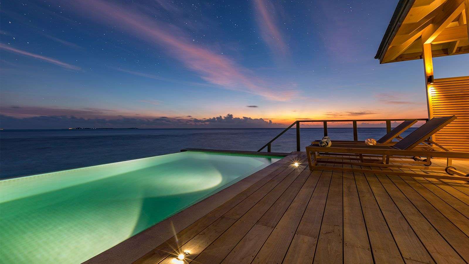 Communal freshwater infinity swimming pool at Hurawalhi Island Resort